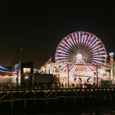 Luxury vehicle parked near Santa Monica Pier offering premium LAX car service for travelers arriving in Los Angeles.