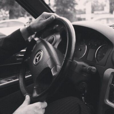 LAX VIP chauffeur driving a car.